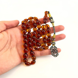 كهرمان طبيعي لون عسلي طربزون فضة