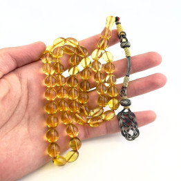 كهرمان طبيعي شفاف طربزونة فضة 